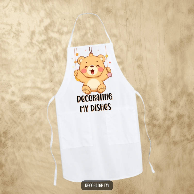 Funny bear cub enthusiastically hanging shiny ornaments, printed on a durable kitchen apron for humorous holiday baking.