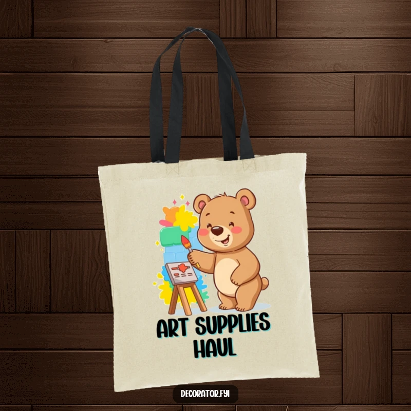 Funny bear tote bag featuring a smiling bear happily painting a vibrant mural on a small wall, symbolizing creativity.